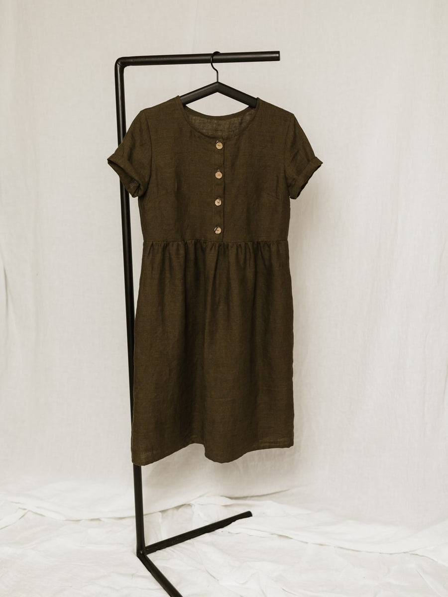 A handmade linen dress with gathered waist, buttons, and pockets. Perfect for the sustainable closet. Make with high quality, linen fabric and sizes can be customized.