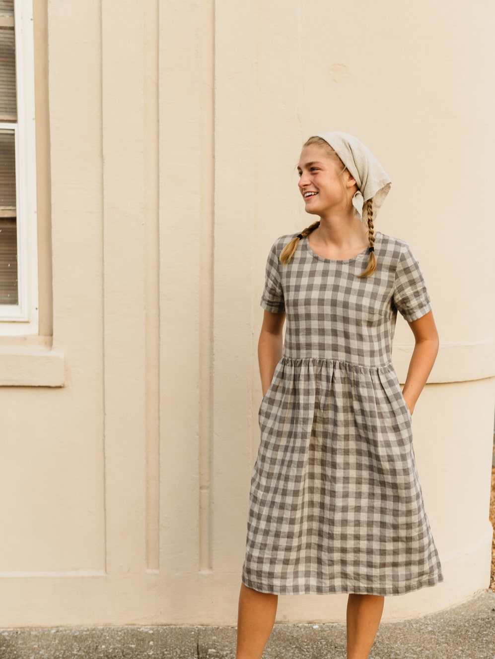 The Aaro smock is a handmade linen dress featuring a more structured bodice, including a set in sleeve and side bust darts, with an easy flowing skirt. The gathered waist skirt includes hidden side seam pockets.